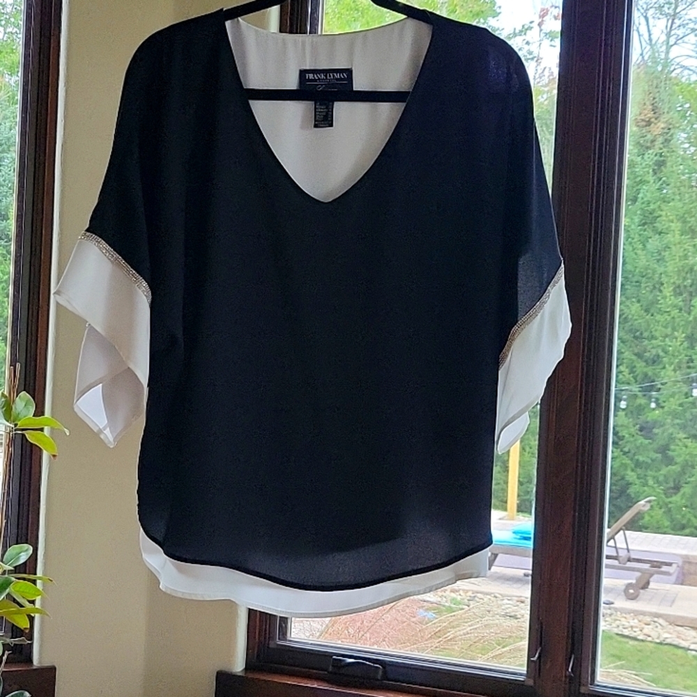 Frank Lyman black with white underlay silver trim on the sleeves size 8
